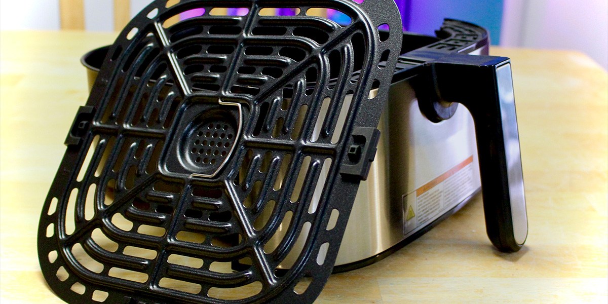 Closeup of Instant Vortex Plus XL next to cooking basket Closeup of Instant Vortex Plus XL next to cooking basket