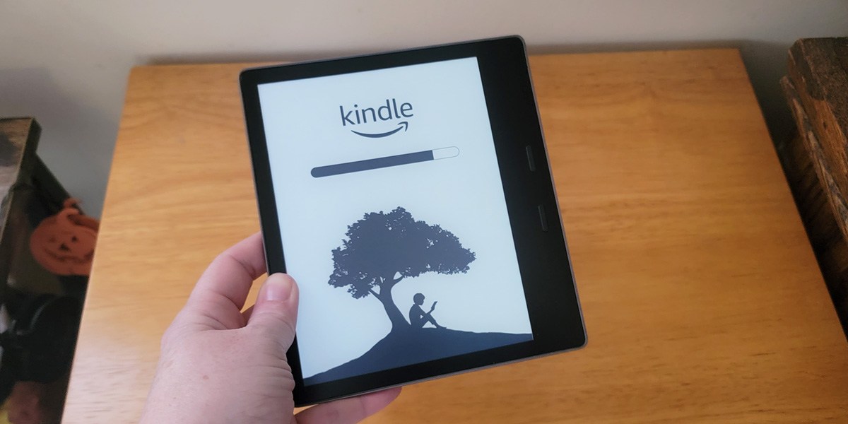 Hand holding Kindle e-reader