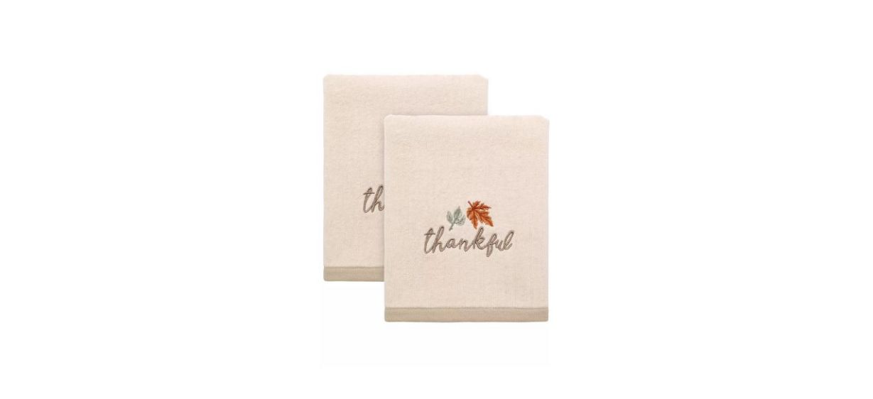 2 beige hand towels that say &quot;thankful&quot; in script font and have a picture of an orange maple leaf