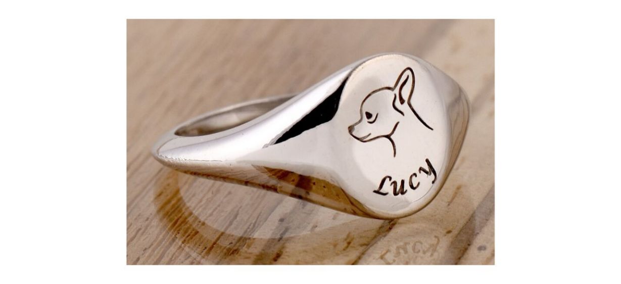 silver signet ring with engraving of dog's face and dog name
