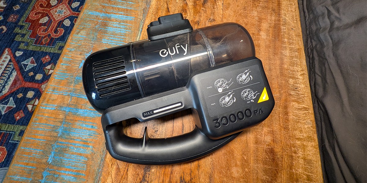 A vacuum motor on a table to demonstrate how the unit looks detached from the stick attachment and robot vacuum shell