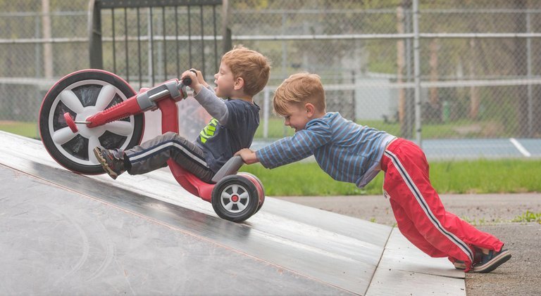 kids riding big wheels